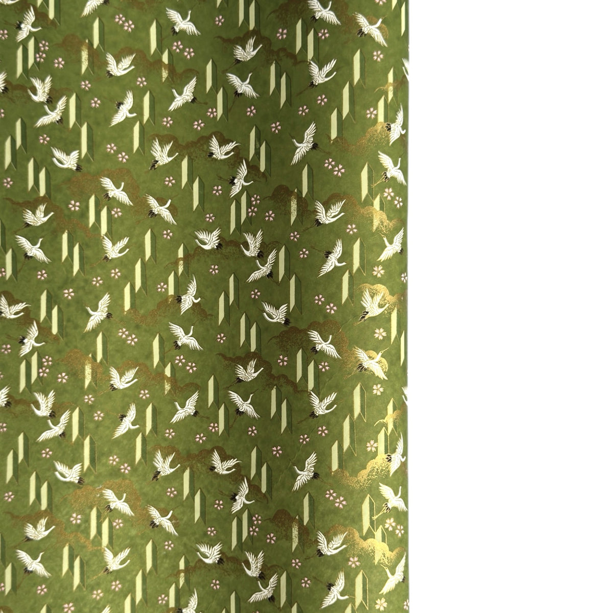 a sheet of Japanese chiyogami paper with an olive green ground and a pattern of white flying cranes and arrows.  There are also little pink cherry blossom flowers and gold clouds.
