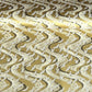 a sheet of Japanese chiyogami paper hand screen printed with a pattern of white cranes in flight.  The back drop is silver and lack swirling lines on gold. 