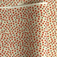 japanese silk-screen handmade paper, chiyogami, with red and aqua plum flowers repeat pattern