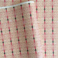 Japanese silkscreen chiyogami paper with a intricate filigree trellis design in pink with gold accent