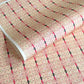 Japanese silkscreen chiyogami paper with a intricate filigree trellis design in pink with gold accent