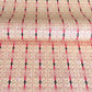 Japanese silkscreen chiyogami paper with a intricate filigree trellis design in pink with gold accent