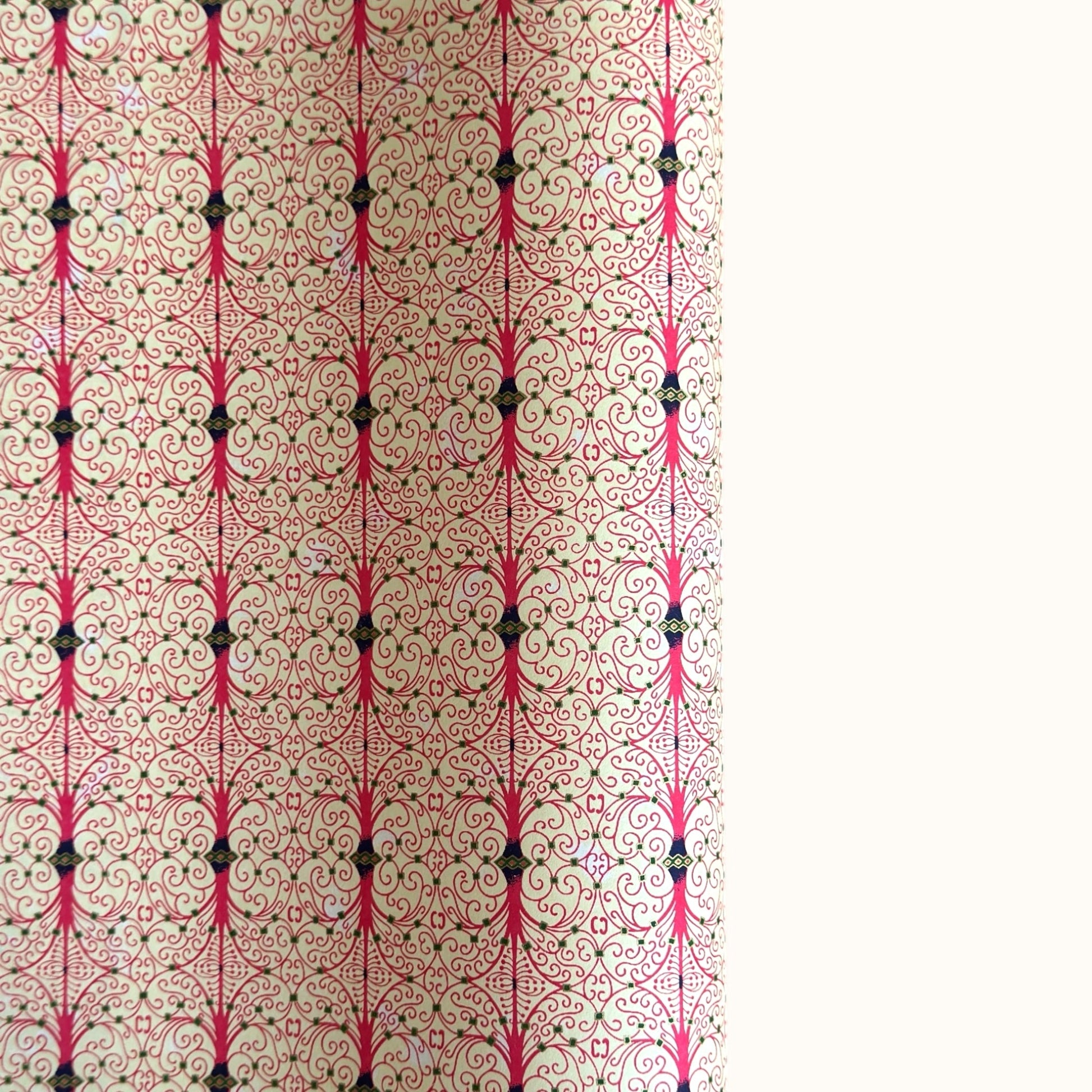 Japanese silkscreen chiyogami paper with a intricate filigree trellis design in pink with gold accent