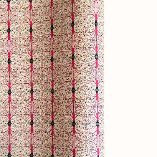 Japanese silkscreen chiyogami paper with a intricate filigree trellis design in pink with gold accent