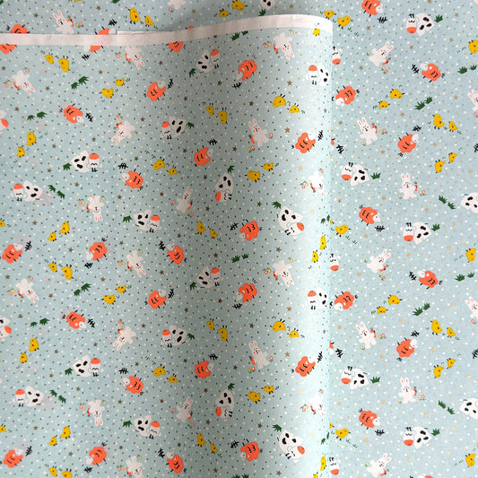 japanese silk-screen handmade paper showing spring animals motifs on a light blue backdrop