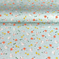japanese silk-screen handmade paper showing spring animals motifs on a light blue backdrop