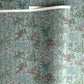 japanese silk-screen handmade paper showing pattern of bamboo, flowers and foliage on light teal backdrop
