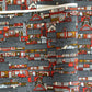 Japanese chiyogami paper (silkscreen printed) with a city landscape in grey, red and orange.