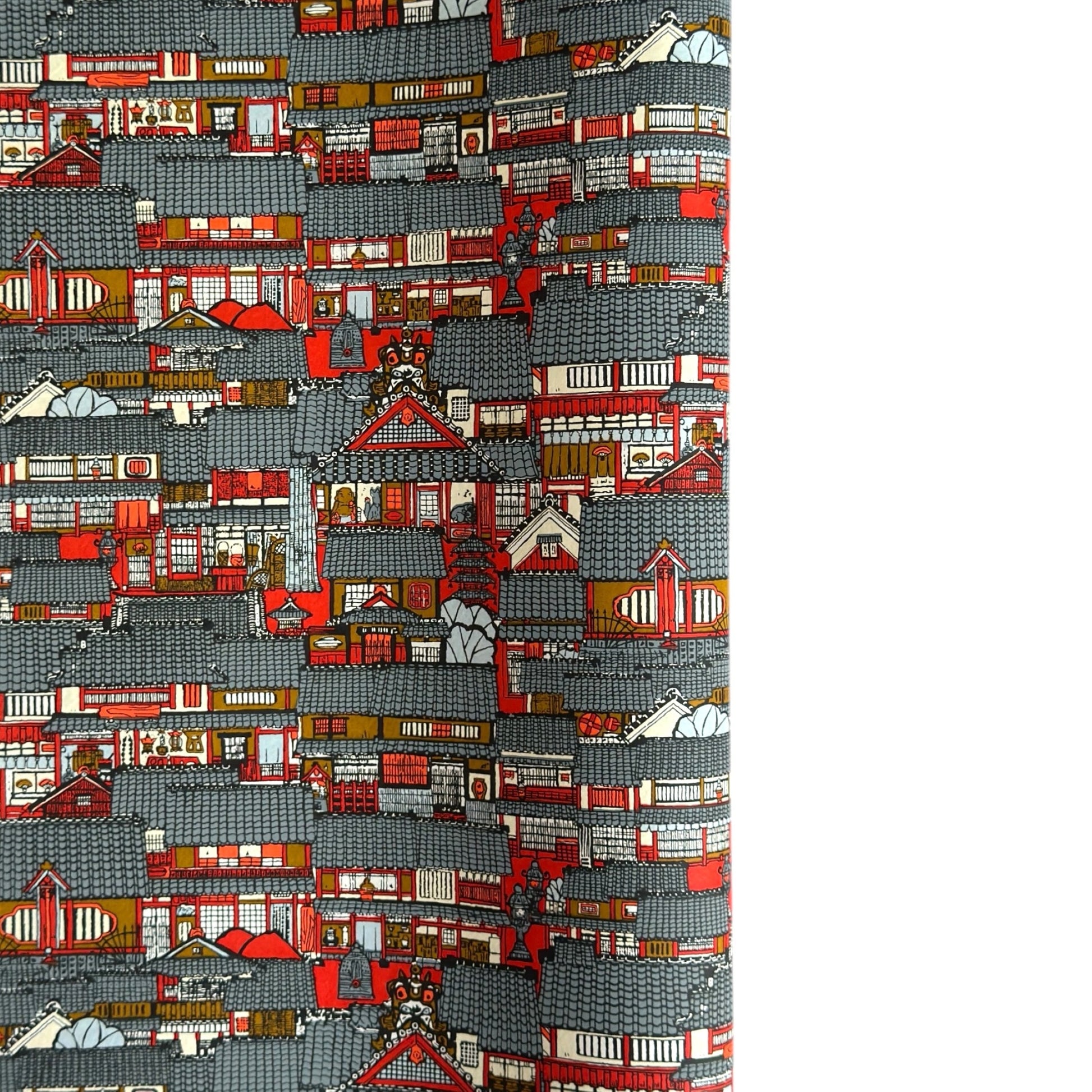 Japanese chiyogami paper (silkscreen printed) with a city landscape in grey, red and orange.