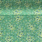Japanese silkscreen chiyogami paper with a delicate butterfly pattern on a teal backdrop