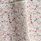 Japanese chiyogami paper with pale pink plum blossom, dark brown branches on an ivory background.