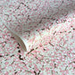 Japanese chiyogami paper with pale pink plum blossom, dark brown branches on an ivory background.