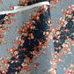 Diagonal branches of rich pink plum (ume) blossom on a midnight blue background with gold accents. Japanese chiyogami paper