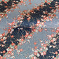 Diagonal branches of rich pink plum (ume) blossom on a midnight blue background with gold accents. Japanese chiyogami paper
