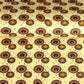 Japanese silkscreen chiyogami paper with a brown and orange umbrella pattern on a buttermilk backdrop 
