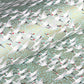 japanese silk-screen handmade paper showing white cranes in flight on a light teal and gold backdrop