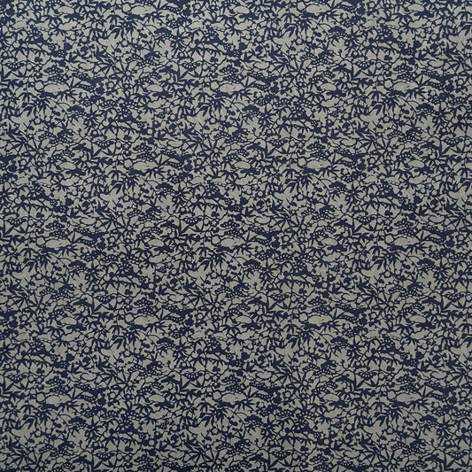 a sheet of Japanese chiyogami yuzen paper with a small abstract pattern in midnight blue on grey