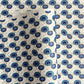 japanese silk-screen handmade paper showing a repeat pattern of blue umbrellas with gold highlights