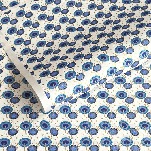 japanese silk-screen handmade paper showing a repeat pattern of blue umbrellas with gold highlights