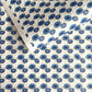 japanese silk-screen handmade paper showing a repeat pattern of blue umbrellas with gold highlights