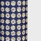 Small pattern with abstract circular flowers in white, red and yellow on a dark blue background. A sheet of katazome paper. Close up