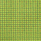 A sheet of Japanese katazome paper with a delicate floral tile repeat pattern on vibrant lime green
