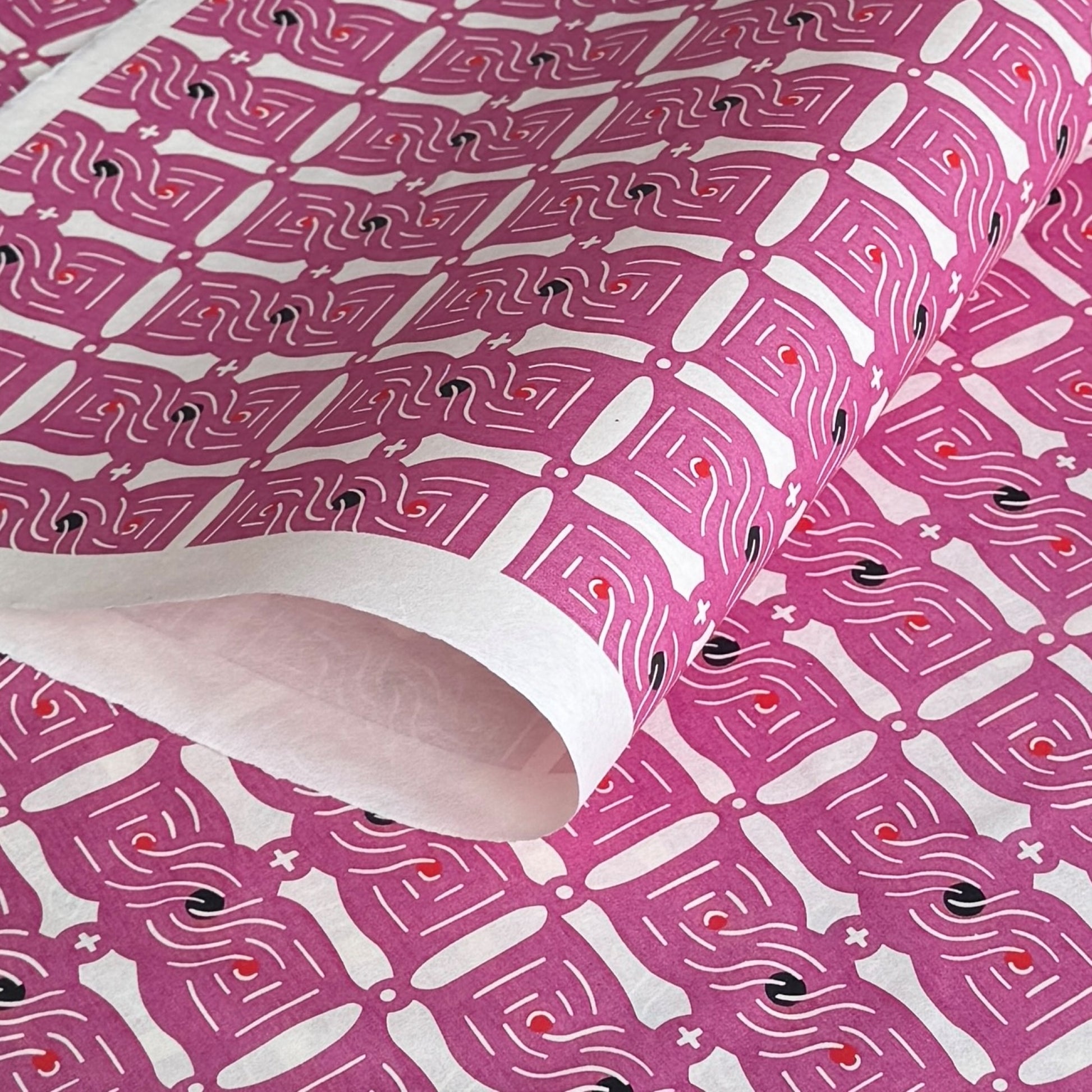 Knot (musubime) pattern in pink on a Japanese katazome paper