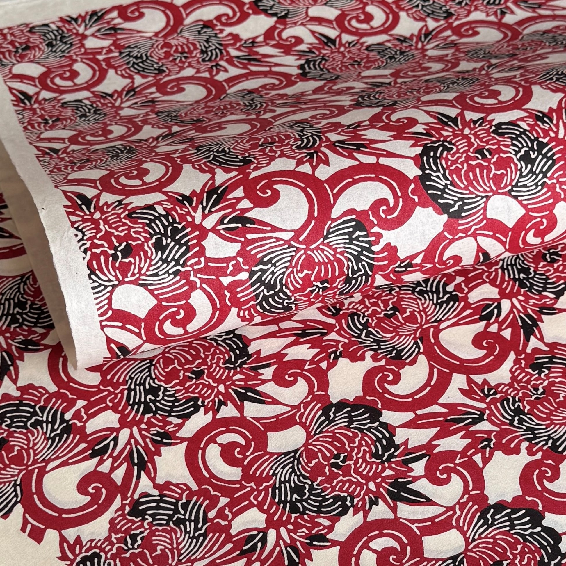Pattern of berry red peonies (botan) on a sheet of Japanese katazome paper