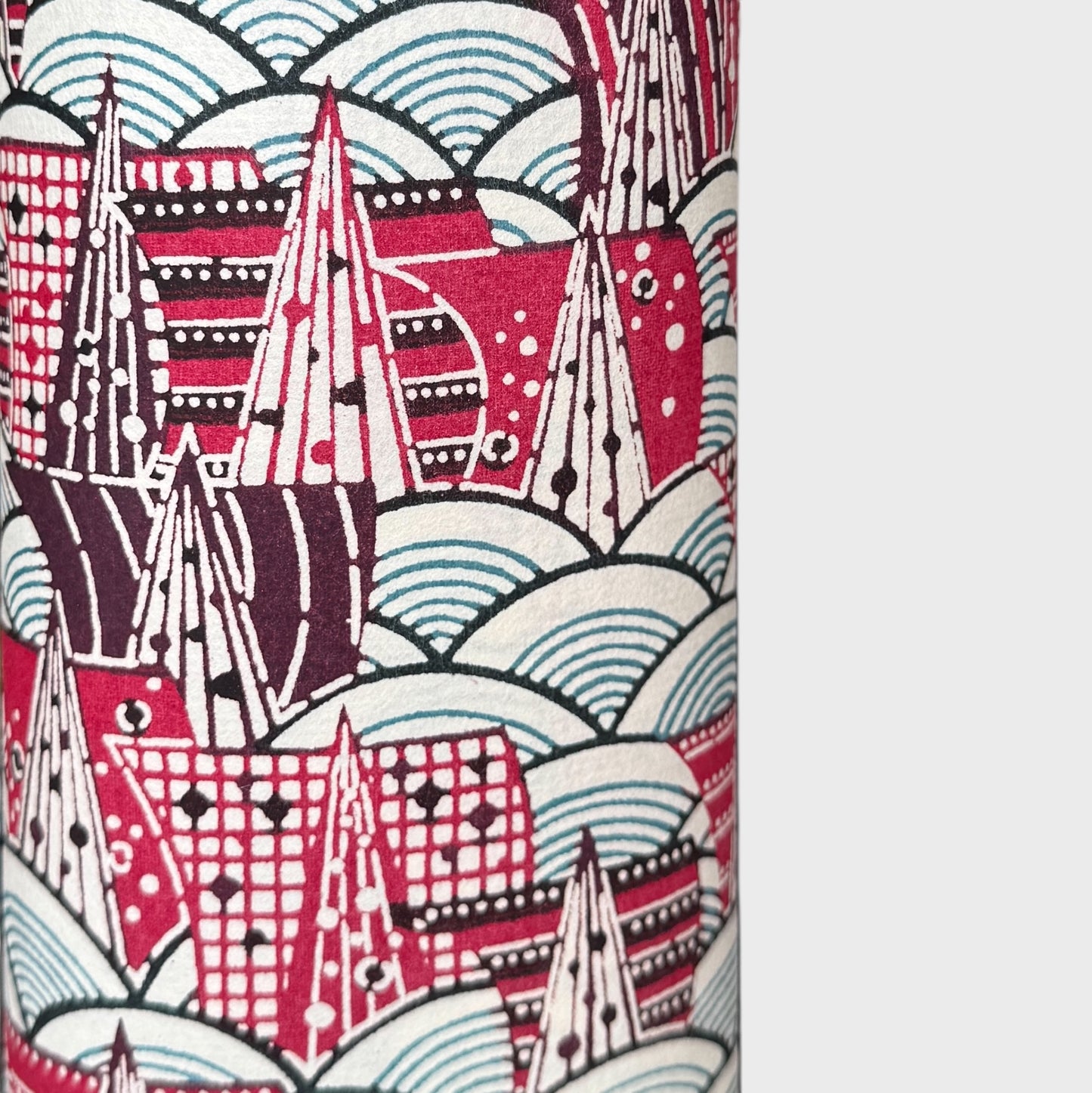 A Japanese skyline with with buildings and rivers.  Japanese katazome shi stencil-dyed paper. Close up