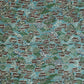 A Japanese pattern of hillside villages.  Katazome stencil-dyed paper from Japan in colours of blue, green, brown and white