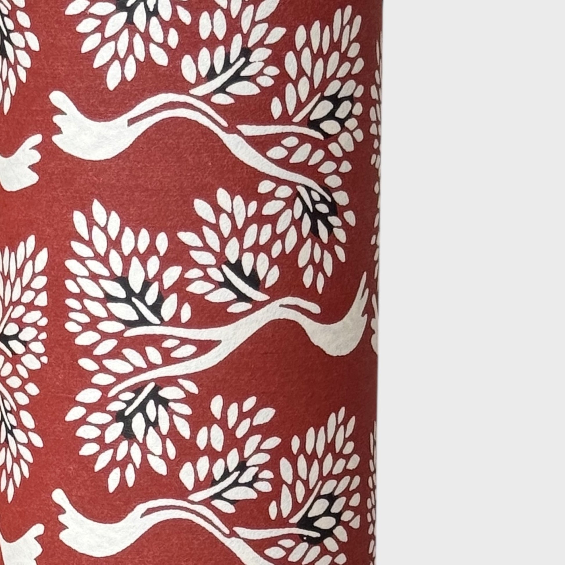Large bonsai tree repeat motifs on brown. A sheet of Japanese katazome shi paper. Close up