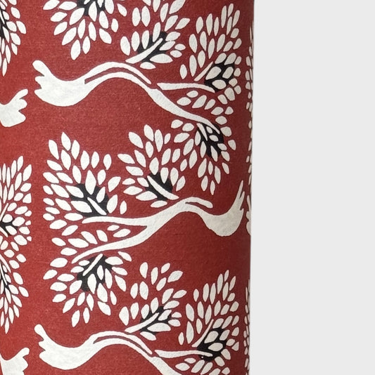 Large bonsai tree repeat motifs on brown. A sheet of Japanese katazome shi paper. Close up