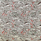 A botanical pattern with bamboo (take) and flowers in brown, red and green. A sheet of katazome paper.