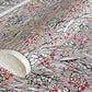 A botanical pattern with bamboo (take) and flowers in brown, red and green. A sheet of katazome paper.