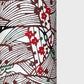 A botanical pattern with bamboo (take) and flowers in brown, red and green. A sheet of katazome paper. Close up