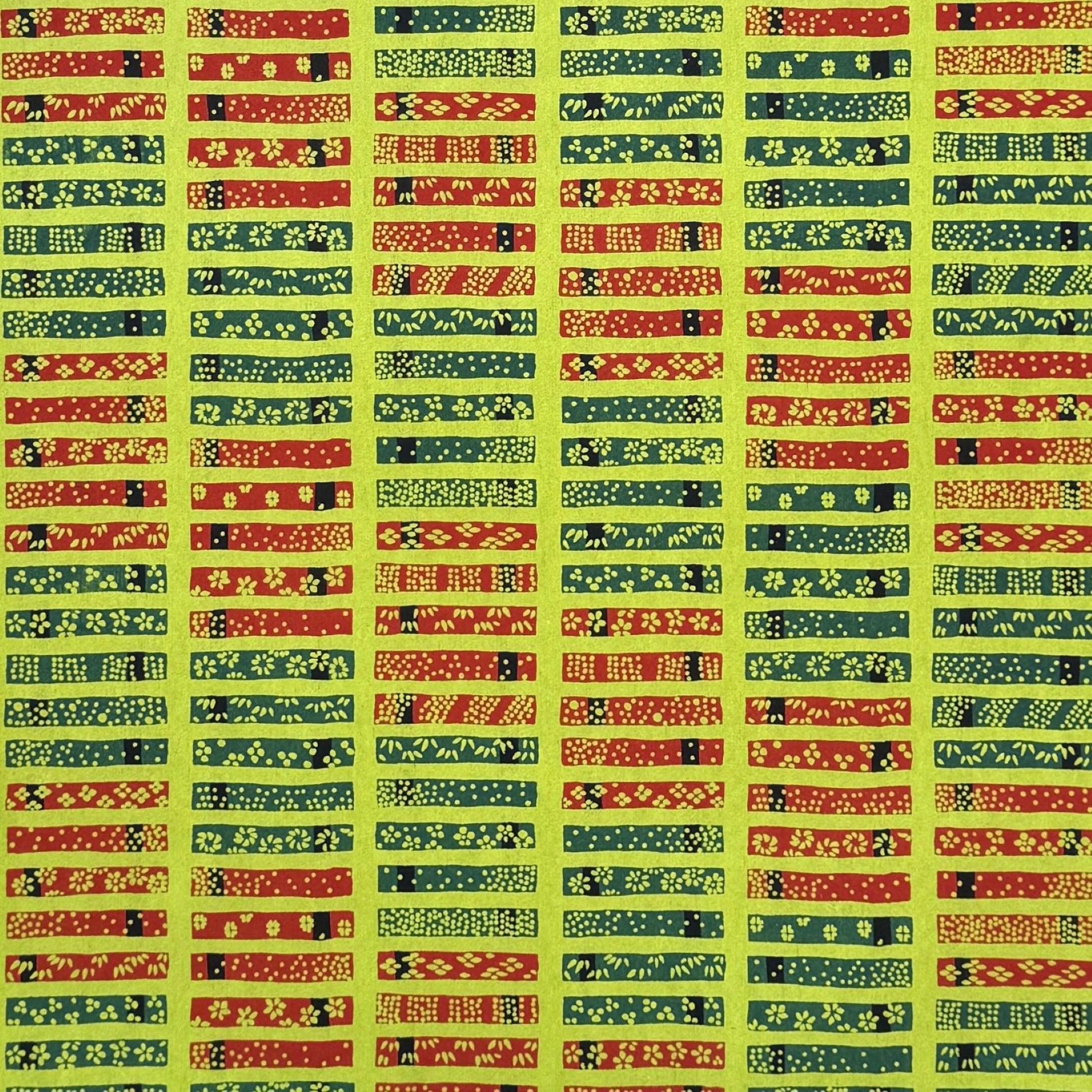 Floral patterned rectangles on vibrant lime green. A sheet of katazome paper