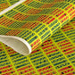 Floral patterned rectangles on vibrant lime green. A sheet of katazome paper