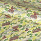 a sheet of katazome paper with a pattern of a hillside village in lime green, green and brown