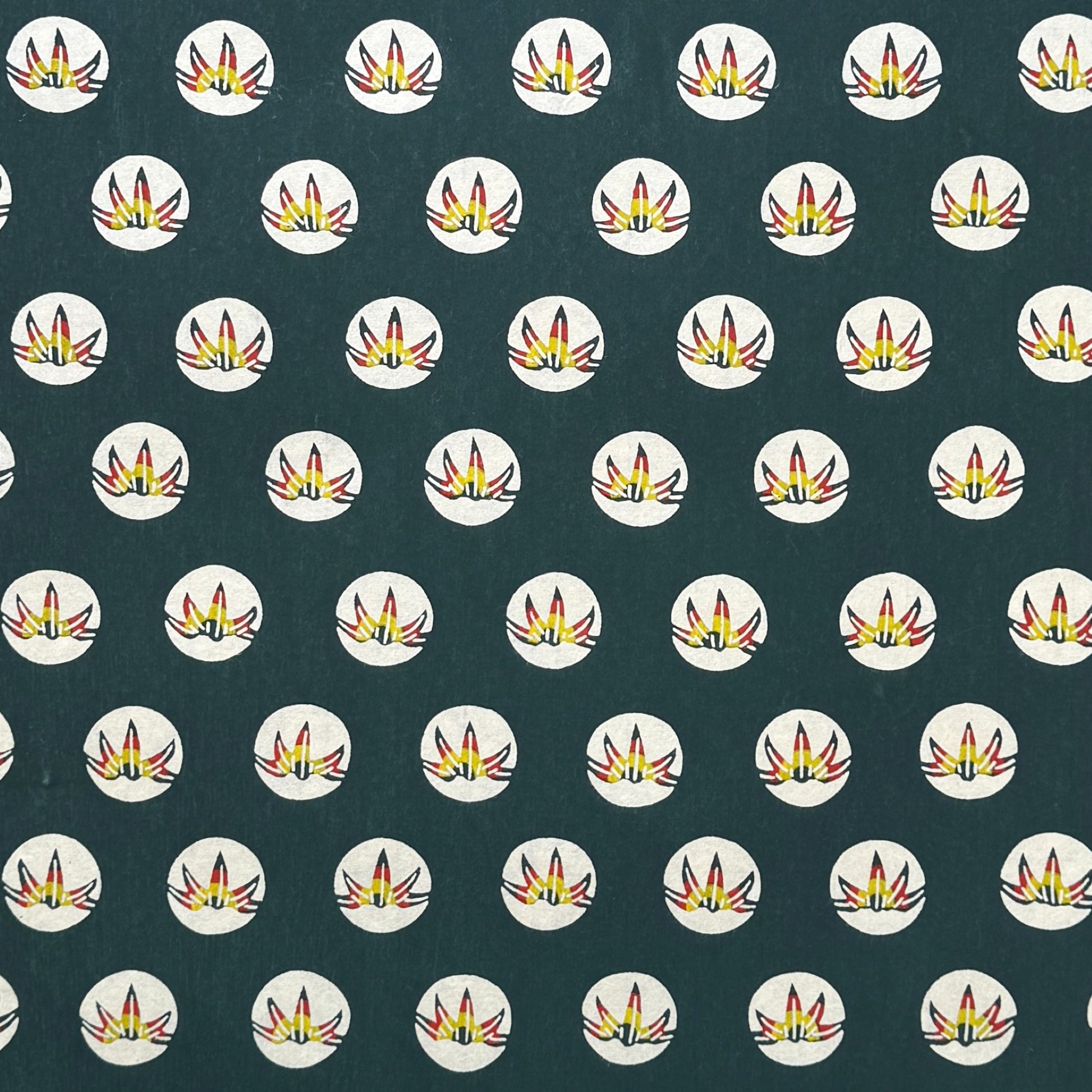 Traditional pattern a Japanese circular crest of a colourful lotus flower on a dark teal.  A shhet of katazome paper