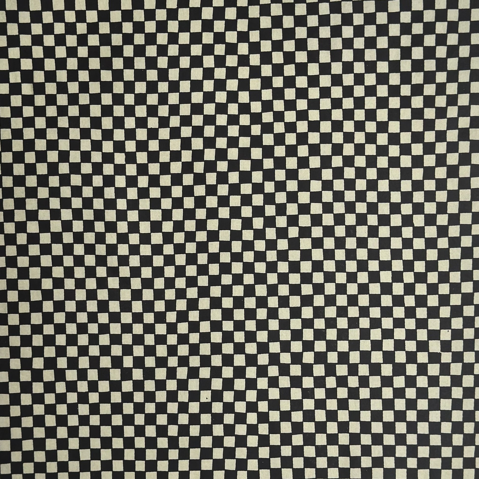a sheet of Japanese katazome paper with a chequer pattern (ichimatsu) in black and soft grey