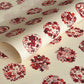 Inky rich red botanical motif circles (maru mon) on plain ivory Jpaanese katazome-shi paper