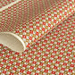 Geometric two-tone brown diamond (kuginuki tsunagi) repeat pattern on a sheet of Japanese katazome paper