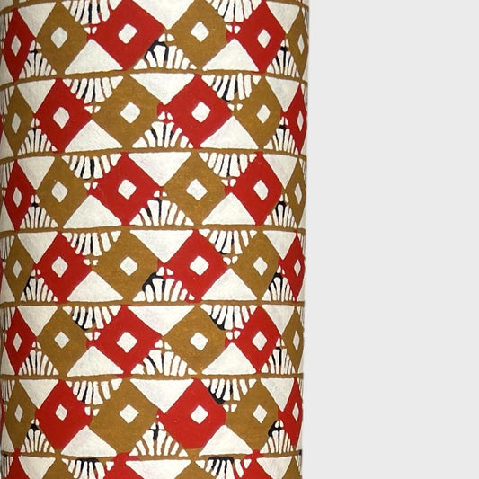 Geometric two-tone brown diamond (kuginuki tsunagi) repeat pattern on a sheet of Japanese katazome paper. Close up