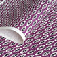 japanese katazome-shi paper (stencil-dyed) with a white and black repeat pattern on purple.