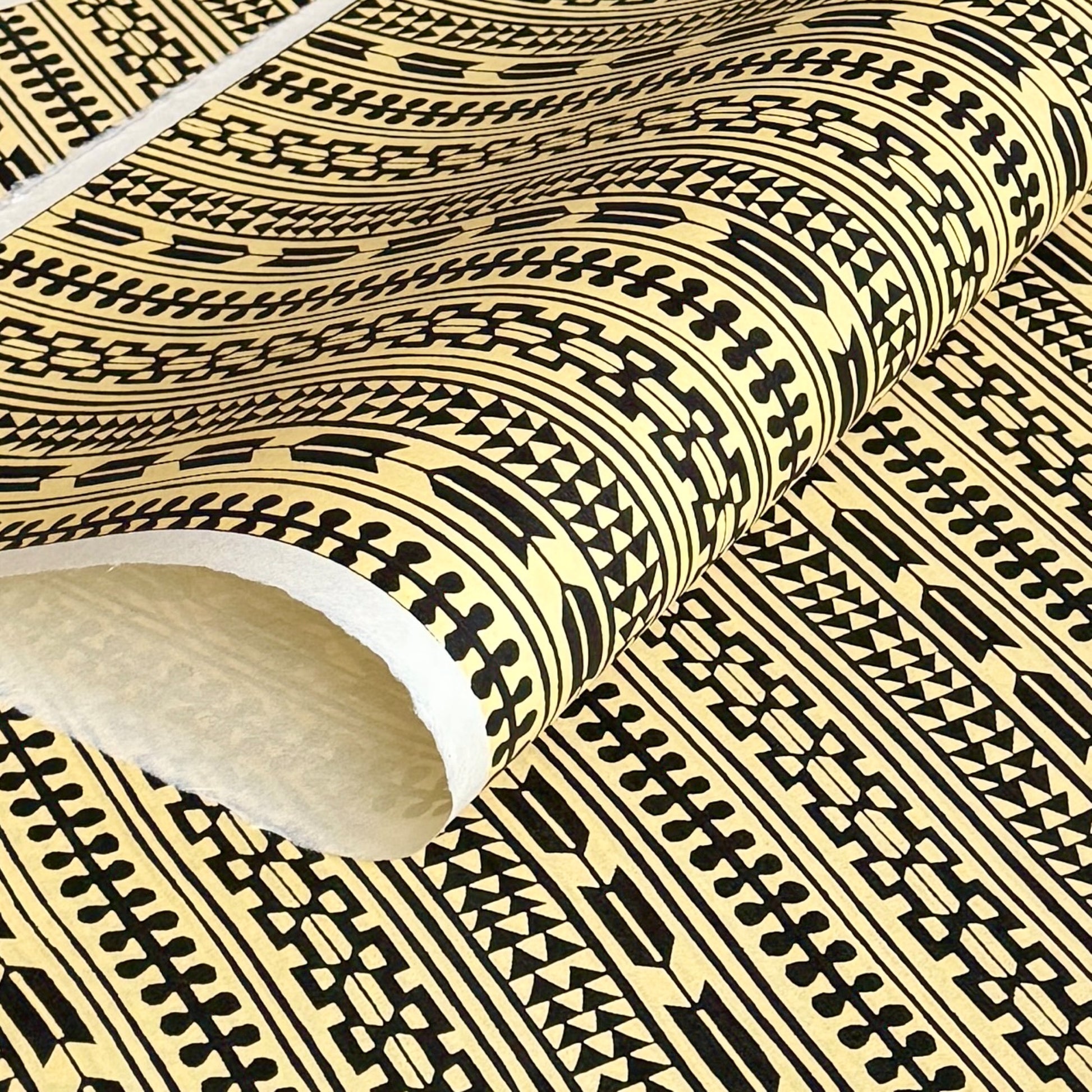 Japanese katazome-shi stencil-dyed paper with striped motifs in black on yellow paper