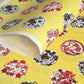 japanese stencil-dyed handmade paper with traditional botanical circles pattern on yellow backdrop