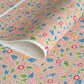 japanese stencil-dyed handmade paper with delicate repeat multi colour floral pattern on blush backdrop