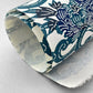 japanese stencil-dyed handmade paper with peony floral repeat pattern in dark teal and blue