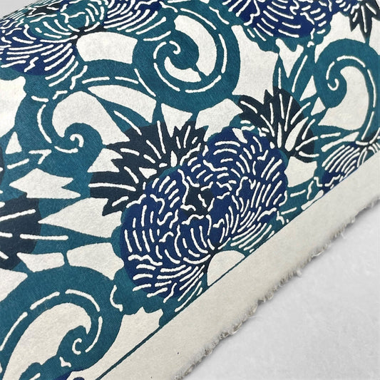 japanese stencil-dyed handmade paper with peony floral repeat pattern in dark teal and blue