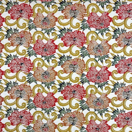 Japanese Katazome-shi stencil-dyed paper with repeat pattern on stylised peonies in autumnal colours.